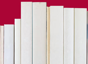 White spine books lined up against burgundy background